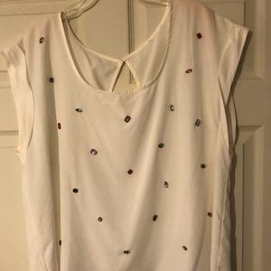 White top with rhinestone embellishments